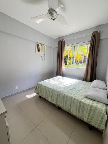 a bedroom with a bed and a window at Porto Real Resort - Leisure and Fun in Mangaratiba