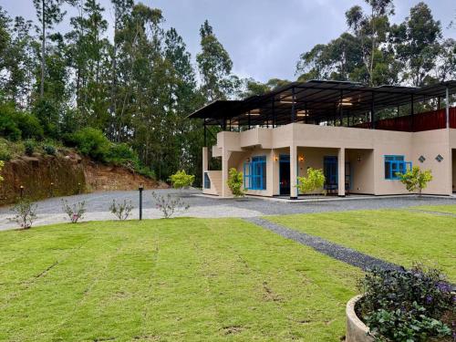 a house with a lawn in front of it at Ayana Gardens Ella in Ella