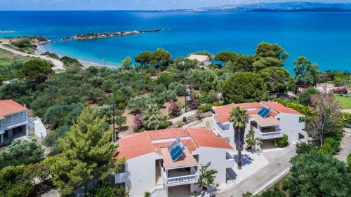 an aerial view of a house with the ocean in the background at Sunset Beach Appartments in Minia