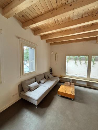 a living room with a couch and a table at El Santo Hostel in Burgos