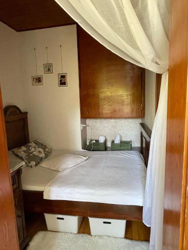 a bedroom with two beds and a canopy at Studio apartman Providenca in Split