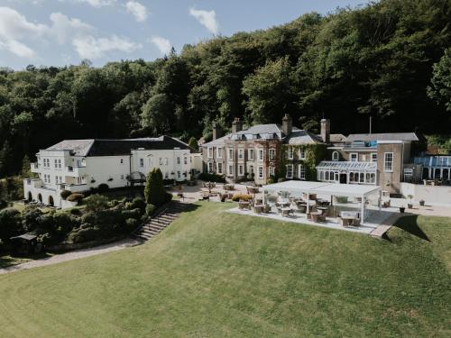 an aerial view of a mansion with a lawn at New House Country Hotel in Cardiff