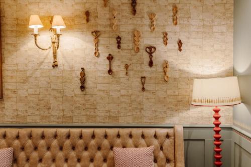 a room with a couch and a wall with fossils at New House Country Hotel in Cardiff
