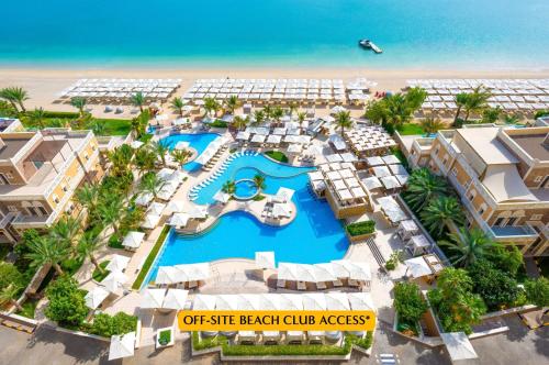 an aerial view of the beach and the resort at The First Collection Marina, Dubai, a Tribute Portfolio Hotel in Dubai