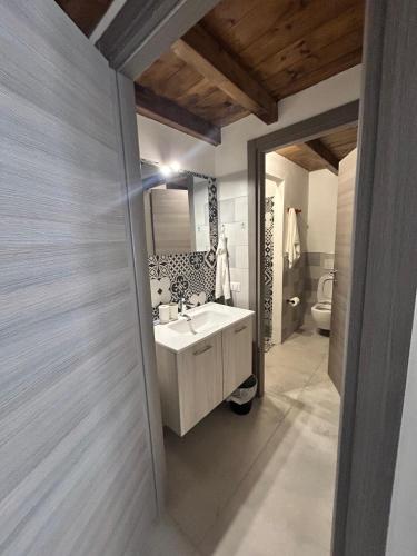a bathroom with a sink and a toilet at MILANO Central Station House in Milan