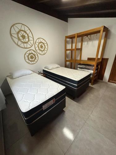 two mattresses sitting on the floor in a room at Loft 2 quartos with full kitchen in Uruçuca