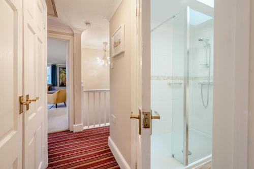 a bathroom with a shower and a glass door at 2 Bed in Sandhurst oc-o34807 in Sandhurst