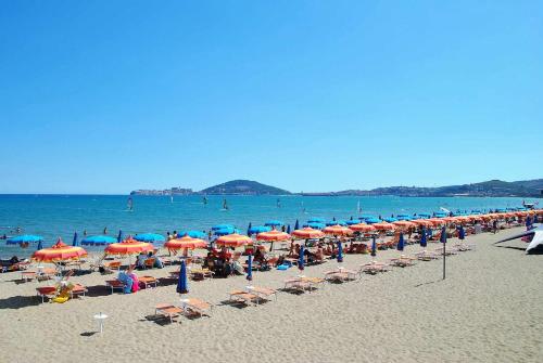 a beach with a lot of umbrellas and people on it at Casa Edy mare e spiaggia a Formia in Latina