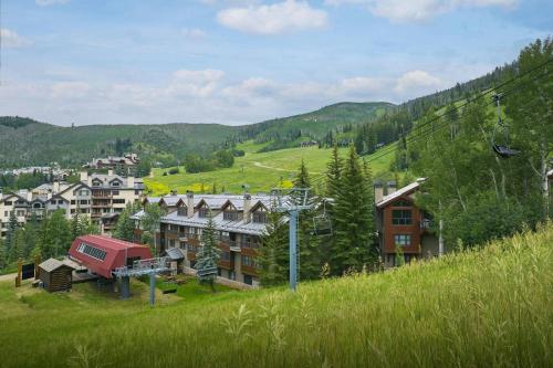 a resort on a hill with a ski lift at The Osprey at Beaver Creek, a RockResort in Beaver Creek