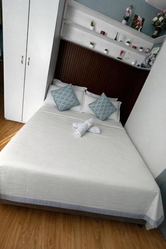 a bed with two stuffed animals on top of it at JAN Studio CDO Condo Stay in Lapasan