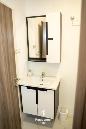 a bathroom with a sink and a mirror at Hotel Residence Travnik in Travnik
