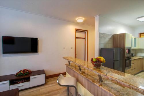 a kitchen with a counter top in a room at Executive Residency by Best Western Nairobi in Nairobi
