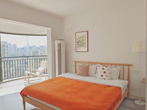 a bedroom with a bed and a balcony at Chihiro Haven in Chongqing