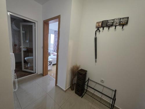 a room with a hallway with a mirror and a wall at Perla View Apartment in Primorsko