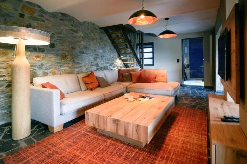 a living room with a couch and a coffee table at Oklm6 in Mellet