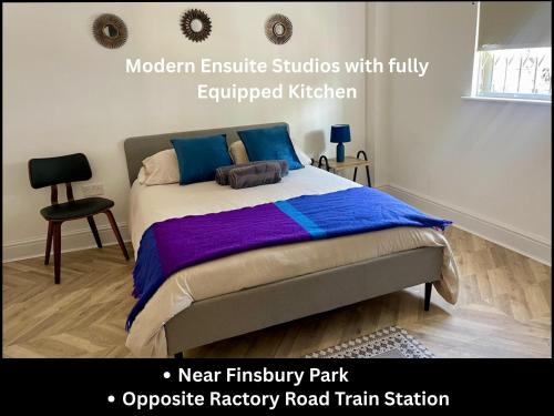 a bedroom with a bed with blue and purple sheets at Dalston Luxe Studios, 10 minutes away from Liverpool Train Station in London