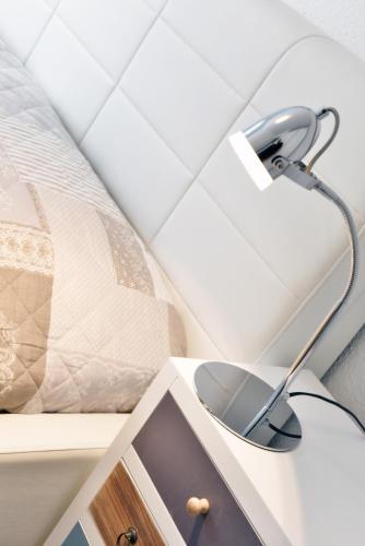 a mirror on a table next to a bed at Urlaubsinsel in Juliusruh