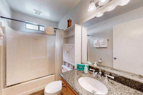 a bathroom with a sink and a toilet and a shower at Mammoth View Villas 30 in Mammoth Lakes