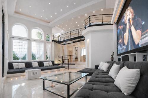 a living room with a couch and a glass table at Mansion Mauresque in Playa del Carmen