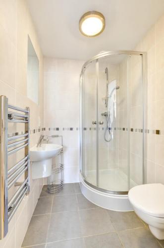 a bathroom with a shower and a sink at 2 Bed in Swanage oc-wy412 in Swanage