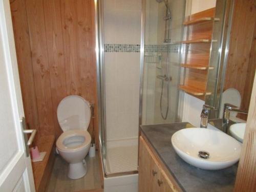 a bathroom with a toilet and a shower and a sink at Studette cosy 2 pers centre station La Mongie - FR-1-404-120 in La Mongie