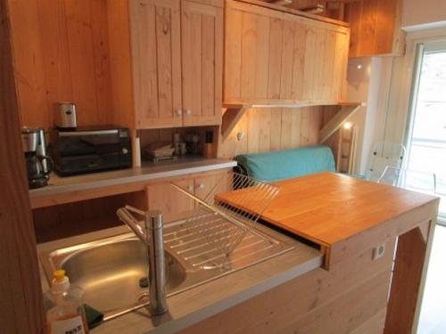 a kitchen with a sink and a counter top at Studette cosy 2 pers centre station La Mongie - FR-1-404-120 in La Mongie