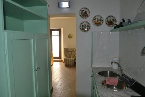 a kitchen with a sink and a counter top at Casa Tirli in Tirli
