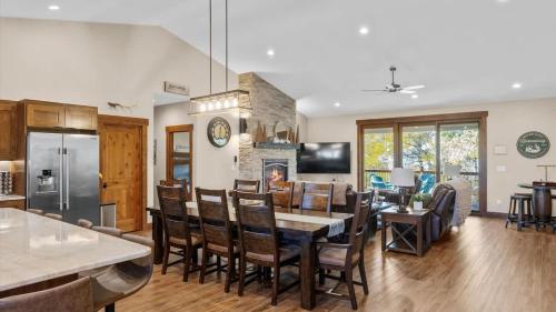 a kitchen and living room with a table and chairs at Willow Creek Hideaway in Red Lodge