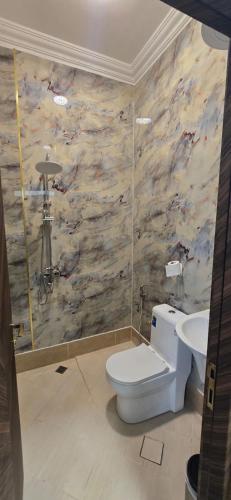 a bathroom with a toilet and a sink at Dar Alslam hostel in Nizwa