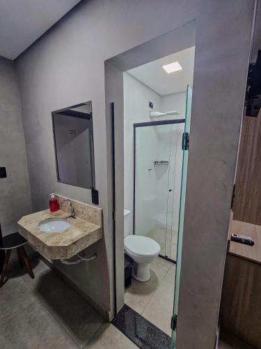 a bathroom with a sink and a toilet at Hotel Pousadas Club Centro in Sorocaba