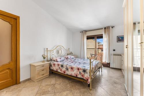 a bedroom with a bed and a dresser and a window at Large apartment with terrace AC e WiFi in Sesto San Giovanni