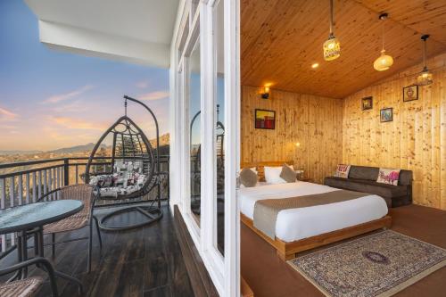 a bedroom with a bed and a balcony at Gadegal Homestay Narkanda - Rooms & Pahadi Café in Shimla