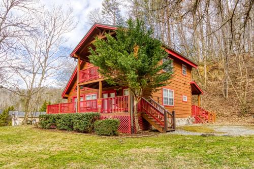 a large red house with a tree in front of it at Ole Red in Gatlinburg