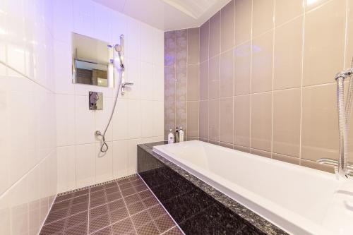 a bathroom with a tub and a shower at Boutique Hotel SB Yeouido in Seoul