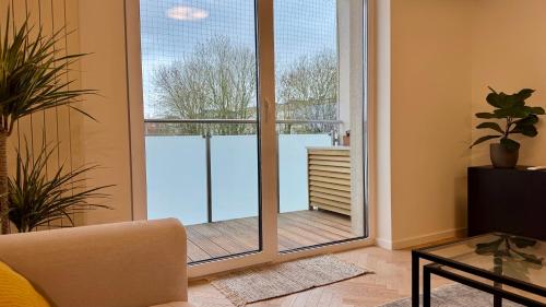 a living room with a sliding glass door at Casa Nostra in Białystok