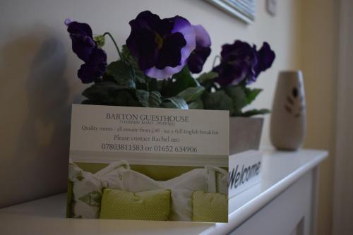 a box sitting on a table with a flower at Barton Guest House in Barton upon Humber
