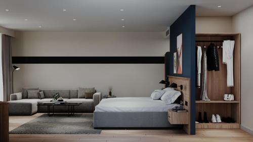 a bedroom with a bed and a couch at Spark By Hilton Van City Centre in Van