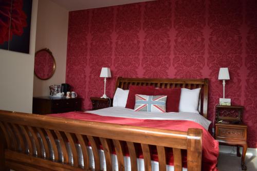 Säng eller sängar i ett rum på Barton Guest House