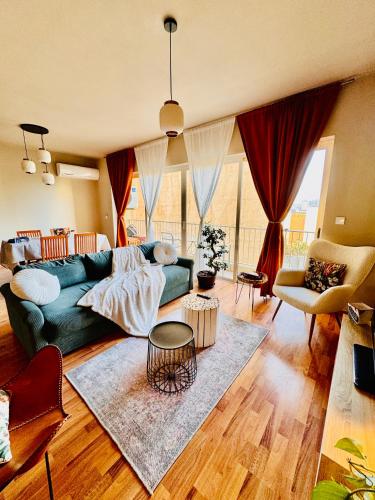 a living room with a couch and a table at Sea View apartment in Sliema in Sliema