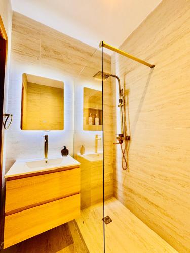 a bathroom with a sink and a shower at Sea View apartment in Sliema in Sliema