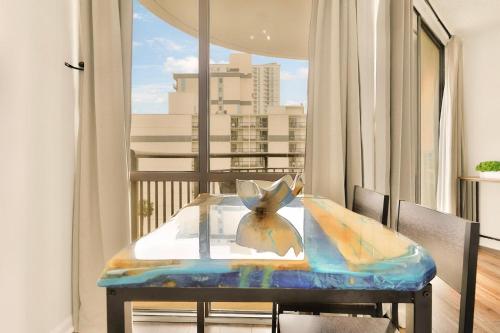 a table on a balcony with a view of a city at Oceanview King Suite @ Meridian Plaza by Wavecrest Beach Vacations in Myrtle Beach