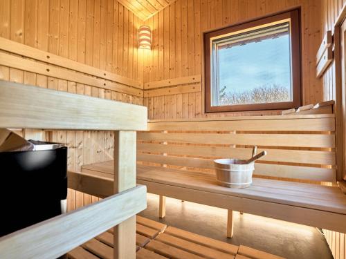a wooden sauna with a bucket in it at Chalet Popcorn by Interhome in Abertamy