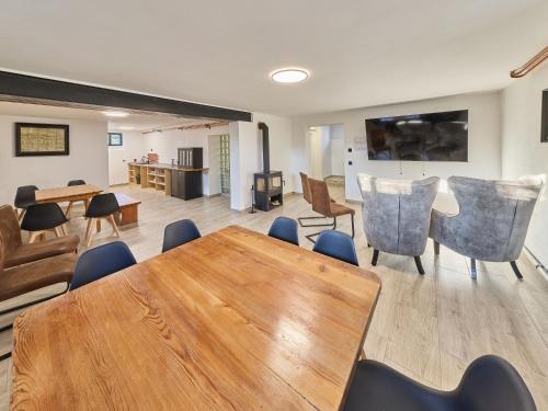 a dining room with a table and chairs at Villa Švýcarka by Interhome in Mladé Buky