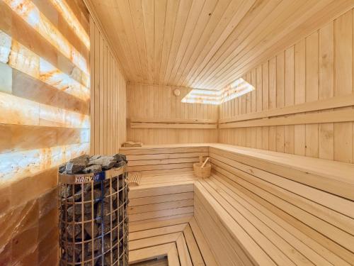 a wooden sauna with a wooden floor and ceiling at Villa Švýcarka by Interhome in Mladé Buky