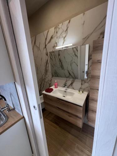 a bathroom with a sink and a mirror at Moonlight Etna B&B Catania in Catania