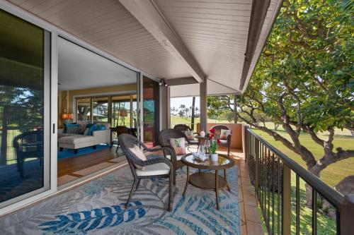 a patio with a table and chairs on a balcony at Maui Eldorado H202 in Kaanapali