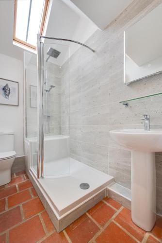 a bathroom with a shower and a sink at 3 Bed in Ridlington oc-2253 in Walcott