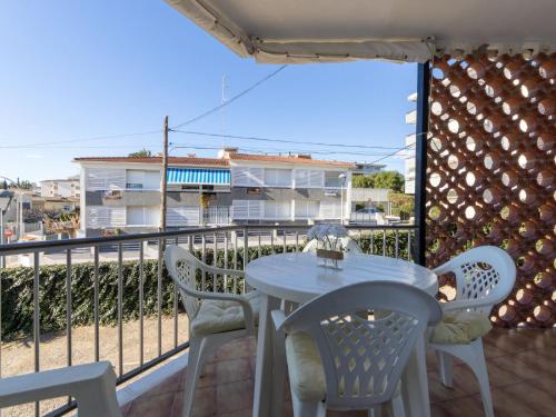 a patio with a table and chairs on a balcony at Apartment Delfines by Interhome in Cambrils