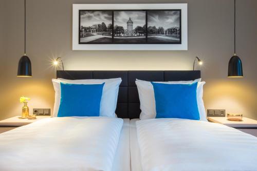 Un ou plusieurs lits dans un hébergement de l'établissement Radisson Blu Hotel, Mannheim