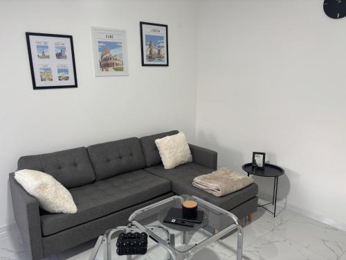 a living room with a couch and a table at Apartman Rose in Čapljina